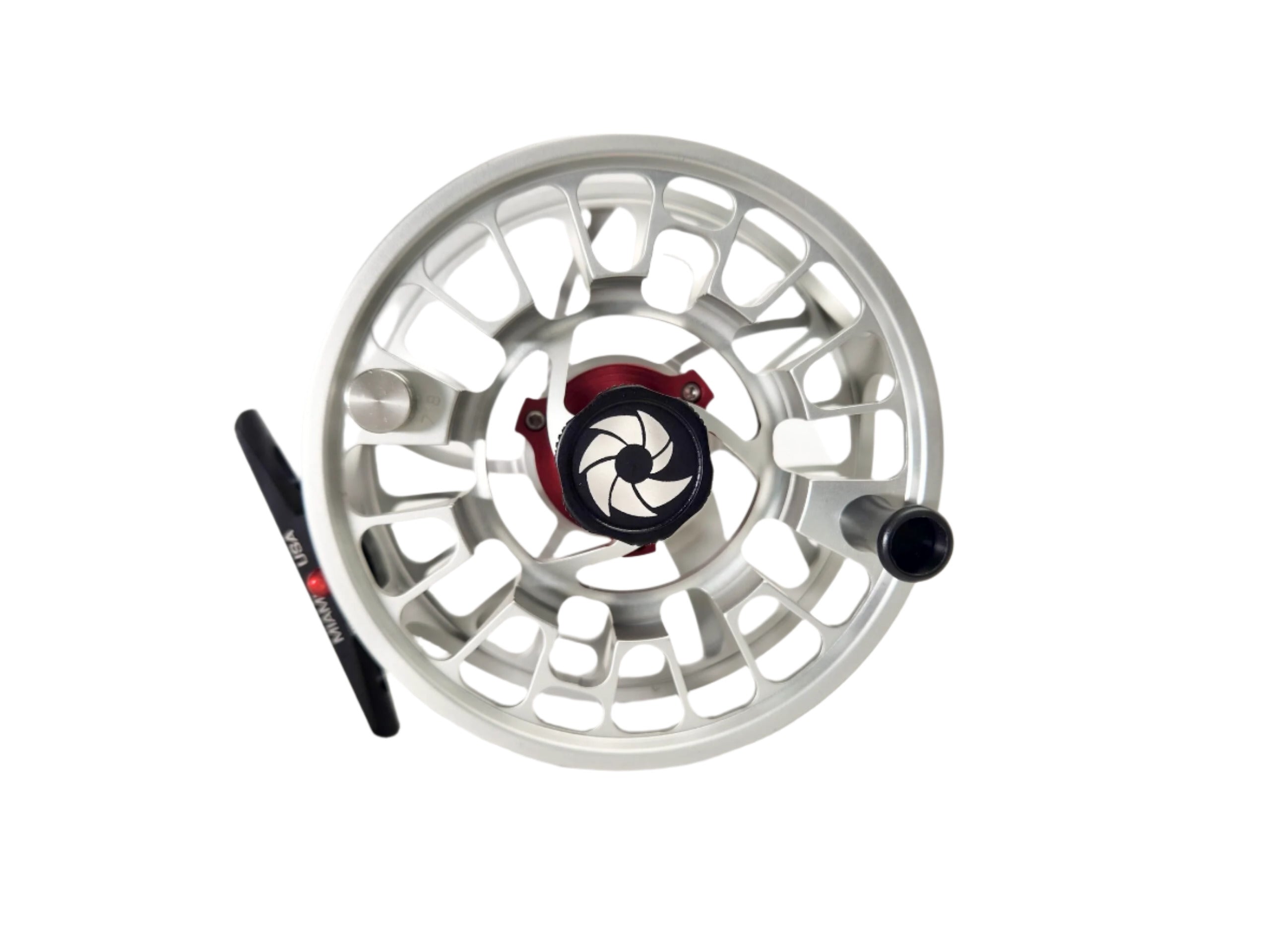 A silver fly fishing reel with a black handle, viewed from the side on a white background.