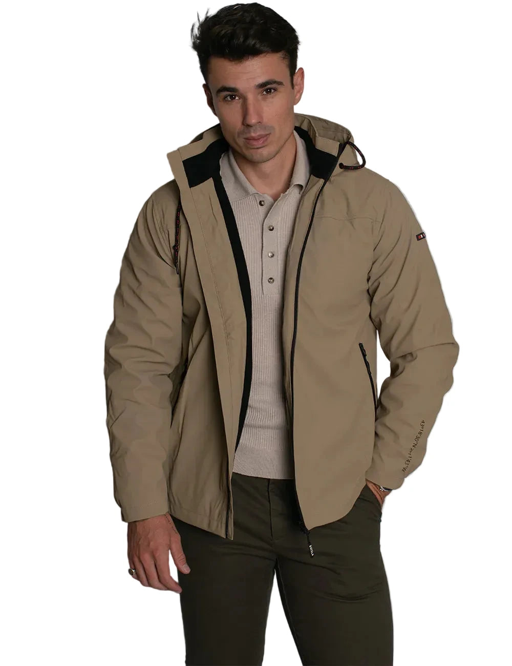 Man wearing a beige jacket with a hood against a plain background