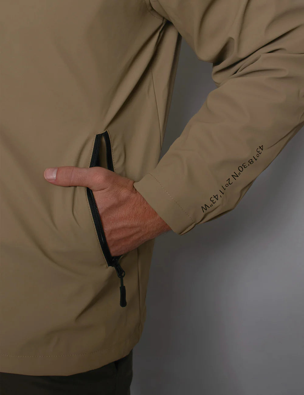 Batela Beige jacket with a brand logo on a gray background