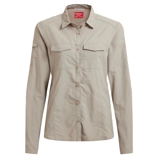 Light beige
 shirt with button details on a beige background